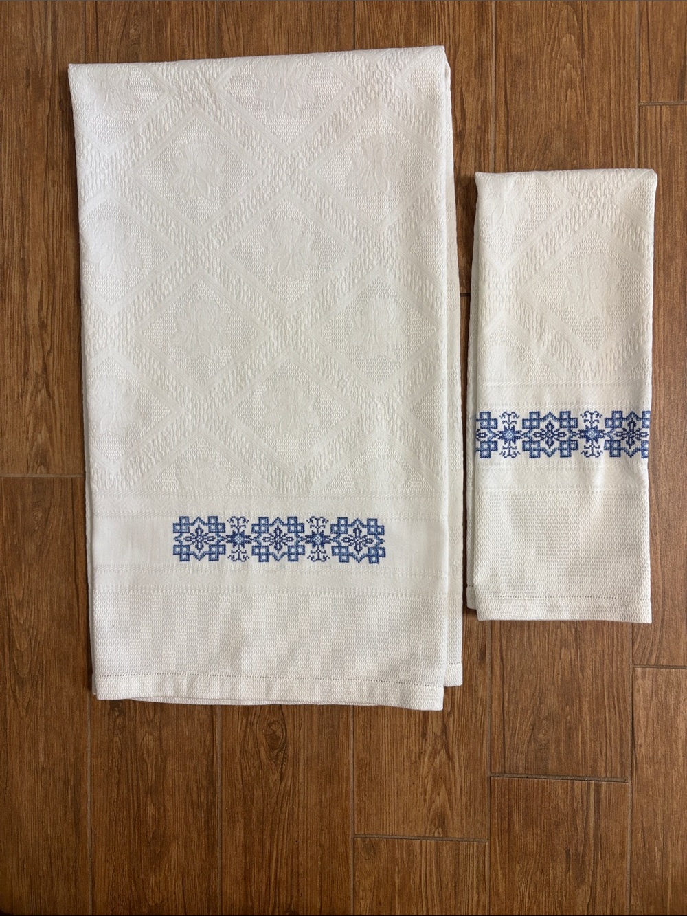 White Embroidered Linen Towels with Blue Floral Motif